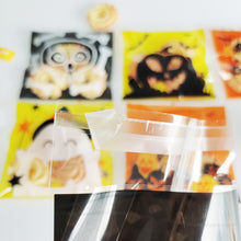 Load image into Gallery viewer, 100Pcs Halloween Plastic Candy Bag Skull Pumpkin Ghost Opp Transparent Gift Bag for Halloween Party Cookie Biscuit Packaging Bag