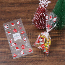 Load image into Gallery viewer, 50Pcs Xmas Cookie Packing Bags Christmas Cellophane Party Bags Treat Candy Bag Festival Party Favor Gift Merry Christmas Hallowe