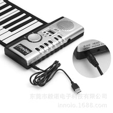Load image into Gallery viewer, 61键手卷钢琴带喇叭儿童成人硅胶电子琴键盘启蒙钢琴一件代发跨境
